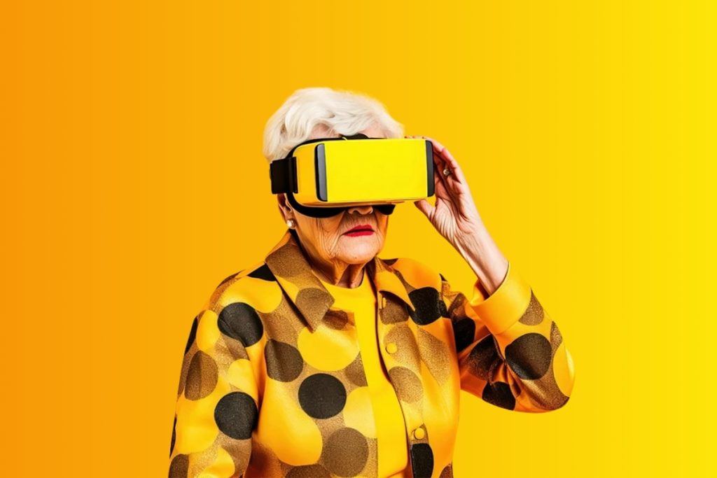 An older woman with white hair wearing a yellow and black polka-dot jacket and a yellow VR headset against a solid yellow background.