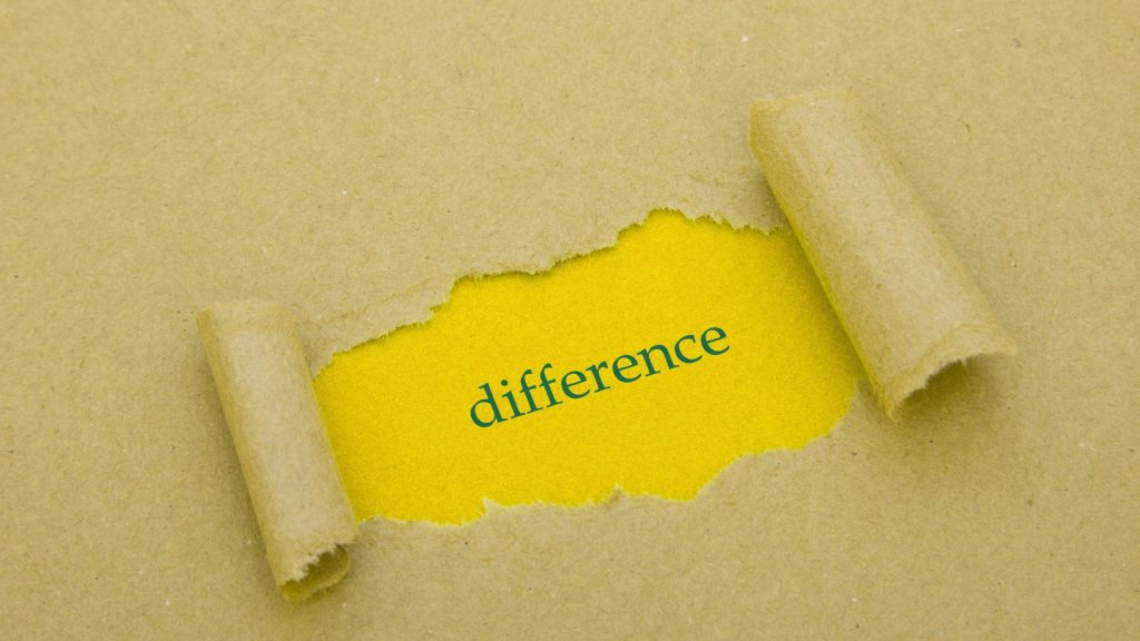 A piece of brown craft paper is torn in the centre, revealing a bright yellow background with the word "difference" in green lowercase letters. The torn edges are rolled up on the left and right sides.